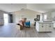 Spacious living room with tall ceilings, new flooring, and an open layout flowing into the kitchen at 82 Asher Pointe Way, Benson, NC 27504