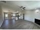 Spacious living room and kitchen area featuring vaulted ceilings, modern fixtures, and hardwood floors at 82 Asher Pointe Way, Benson, NC 27504