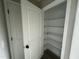 This pantry has white metal shelving and white walls at 82 Asher Pointe Way, Benson, NC 27504