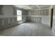 Room under construction with a large window for natural light and raw walls ready for final touches at 82 Asher Pointe Way, Benson, NC 27504