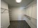 Spacious walk-in closet with adjustable wire shelving for optimal storage organization at 82 Asher Pointe Way, Benson, NC 27504