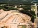 Aerial view of a construction site showcasing land development, excavation, and infrastructure work in progress at 8717 Wardle Ct, Raleigh, NC 27616