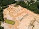 An aerial view of new construction showing land development for new homes surrounded by mature forest at 8717 Wardle Ct, Raleigh, NC 27616