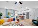 Bright living room and kitchen area with a modern design, light wood floors, and stainless steel appliances at 8717 Wardle Ct, Raleigh, NC 27616