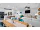 Open-concept living area showcasing the kitchen, dining space, and living room, perfect for entertaining at 8717 Wardle Ct, Raleigh, NC 27616