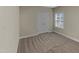 Neutral bedroom features double doors to a closet and a window with blinds at 95 Cinnamon Teal Way, Youngsville, NC 27596