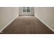 Spacious bedroom with wall-to-wall carpet and a window with blinds at 95 Cinnamon Teal Way, Youngsville, NC 27596