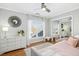 Bright bedroom with hardwood floors, plenty of natural light, and mirrored closet doors at 1002 Augustine Trl, Cary, NC 27518