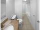 Bright bathroom features a granite vanity top, a standard toilet, and a shower-tub combo at 1004 Carlisle St, Raleigh, NC 27610