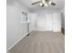 Bedroom features neutral carpet, a ceiling fan, and a window for natural light at 1004 Carlisle St, Raleigh, NC 27610