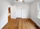 Hardwood flooring and natural light complement this bright bedroom with double door closet at 1004 Carlisle St, Raleigh, NC 27610