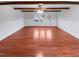 Dining room features hardwood floors, exposed ceiling beams, and a ceiling fan at 1004 Carlisle St, Raleigh, NC 27610