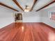 Dining room features hardwood floors, exposed ceiling beams, and an open access to the kitchen at 1004 Carlisle St, Raleigh, NC 27610