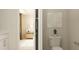 Bright bathroom featuring a toilet, wall art, and view into adjacent bedroom with light-colored furniture at 1006 Sora Way, Durham, NC 27703