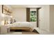 Stylish bedroom with a comfortable bed, decorative pillows, an airplane artwork piece, and soft lighting at 1006 Sora Way, Durham, NC 27703