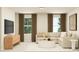 Bright living space with a comfortable sectional sofa and large windows offering ample light at 1006 Sora Way, Durham, NC 27703