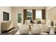 Relaxing living area with a sectional sofa and white armchairs offering a welcoming space at 1006 Sora Way, Durham, NC 27703