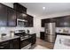 Well-equipped kitchen featuring granite countertops, stainless appliances, and ample storage at 1010 Sora Way, Durham, NC 27703