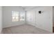 A bright bedroom offers two windows and a closet at 1018 Salt Glaze Ln, Cary, NC 27519