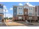 Charming townhome with a mix of brick and siding exterior, plus landscaped front yard at 1018 Salt Glaze Ln, Cary, NC 27519