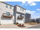 Attractive townhome showcases a private balcony above a single car garage, plus landscaping at 1018 Salt Glaze Ln, Cary, NC 27519