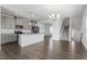 Modern open-concept kitchen features stainless appliances, and island; flows into living space at 1018 Salt Glaze Ln, Cary, NC 27519
