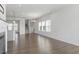 Bright and airy living room featuring lots of windows, open floorplan, and modern fixtures at 1018 Salt Glaze Ln, Cary, NC 27519