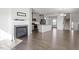 Spacious open-concept living room with fireplace and modern kitchen, perfect for entertaining at 1018 Salt Glaze Ln, Cary, NC 27519