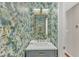 Chic powder room with a floral wallpaper, elegant mirror, and a modern vanity at 104 E Seve Ct, Morrisville, NC 27560