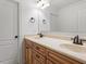 Bathroom features a double sink vanity with wood cabinets and cream marble countertops at 109 Coffeeberry Ct, Garner, NC 27529