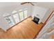 Living room features hardwood floors, fireplace, and large windows offering plenty of natural light at 109 Coffeeberry Ct, Garner, NC 27529