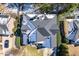 Birds eye view of gray shingled roof, green lawn, and surrounding manicured neighborhood at 113 Witheridge Ct, Apex, NC 27502