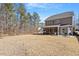 Large backyard with a covered porch, perfect for outdoor entertaining and relaxation at 127 Lakemont Dr, Clayton, NC 27520