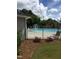 Community pool, with an aqua fountain feature, surrounded by an iron fence at 127 Lakemont Dr, Clayton, NC 27520