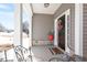Covered front porch featuring stylish décor, a cozy seating area, and an inviting entrance at 127 Lakemont Dr, Clayton, NC 27520