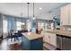 Open concept, with kitchen island, leading into the dining room, creating a spacious entertaining area at 127 Lakemont Dr, Clayton, NC 27520