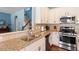 Kitchen showcases granite countertops, a stainless steel dishwasher, and white upper cabinets at 127 Lakemont Dr, Clayton, NC 27520