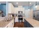 The kitchen features granite counters, an island, and stainless steel appliances at 127 Lakemont Dr, Clayton, NC 27520