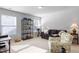 Cozy living room with neutral walls, lots of sunlight and comfortable furniture at 127 Lakemont Dr, Clayton, NC 27520