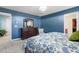 Spacious bedroom with a large dresser, a mirror, and a comfortable queen bed at 127 Lakemont Dr, Clayton, NC 27520