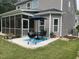 Outdoor patio setup complete with a grill, seating, and shade umbrella, perfect for entertaining at 127 Lakemont Dr, Clayton, NC 27520