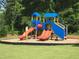 Community playground with colorful play structures and slides for outdoor fun at 127 Lakemont Dr, Clayton, NC 27520