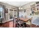 Stylish dining room featuring hardwood floors, a unique table, and a door to the backyard at 13 Piccadilly Ct, Durham, NC 27713