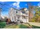 Charming two-story home featuring stone accents, a two-car garage, and a well-manicured lawn at 13 Piccadilly Ct, Durham, NC 27713