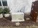 Image features a home generator and landscaped yard area at 13 Piccadilly Ct, Durham, NC 27713