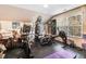 Home gym with exercise equipment, rubber flooring, and natural light from a window at 13 Piccadilly Ct, Durham, NC 27713