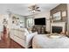 Comfortable living room featuring a fireplace, hardwood floors, and ample seating at 13 Piccadilly Ct, Durham, NC 27713