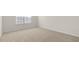 Empty bedroom with neutral carpet and a window for natural light at 132 Paper Birch Way, Fuquay Varina, NC 27526