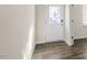 Inviting entryway showcasing wood-look flooring and a decorative glass front door at 132 Paper Birch Way, Fuquay Varina, NC 27526