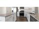 Well-equipped kitchen with granite countertops, stainless steel appliances, and a kitchen island for extra prep space at 132 Paper Birch Way, Fuquay Varina, NC 27526